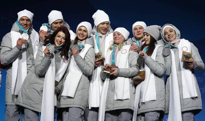 PYEONGCHANG, SOUTH KOREA – FEBRUARY 12, 2018: Olympic Athletes from Russia Dmitri Soloviev, Alexander Enbert, Ekaterina Bobrova, Natalya Zabiyako, Vladimir Morozov, Yevgenia Tarasova, Mikhail Kolyada, Alina Zagitova, and Evgenia Medvedeva, from left, pose with their silver medals during the victory ceremony for the Figure skating Eiskunstlauf team event at the 2018 Winter Olympic Games Olympische Spiele Olympia OS Valery Sharifulin TASS TS0737CC