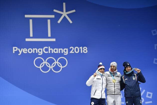 Men s 10-kilometer biathlon sprint medalists from left, the Czech Republic s Michal Krcmar, silver, Germany s Arnd Peiffer, gold, and Italy s Dominik Windisch, bronze, pose during their medals ceremony at the 2018 Winter Olympics in Pyeongchang, South Korea, February 13, 2018. (CTKxPhoto MichalxKamaryt) CTKPhotoP201802130605401 kmt 13