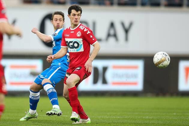 - GENT, BELGIUM: Gent s Brecht Dejaegere and Kortrijk s Gert-Jan De Mets fight for the ball during the Jupiler Pro League match between KAA Gent and KV Kortrijk, in Gent, Sunday 05 April 2015, on the first day of the Play-off 1. BRUNOxFAHY x77559209x