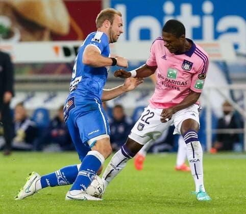 - GENT, BELGIUM: Gent s Laurent Depoitre and Anderlecht s Chancel Mbemba fight for the ball during the Jupiler Pro League match between KAA Gent and RSC Anderlecht, Thursday 30 April 2015 in Gent, on the fifth day of the Play-off 1. VIRGINIExLEFOUR x80473902x
