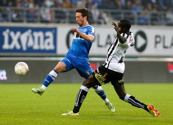 - GENT, BELGIUM: Gent s Brecht Dejaegere and Charleroi s Christophe Diandy fight for the ball during the Jupiler Pro League match between KAA Gent and Sporting Charleroi, Friday 08 May 2015 in Gent, on the seventh day of the Play-off 1. VIRGINIExLEFOUR x80802904x