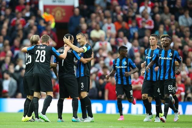 - MANCHESTER, UNITED KINGDOM: Club s players celebrate after scoring during a soccer game between British club Manchester United ManU FC and Belgian team Club Brugge KV in Manchester, United Kingdom, Tuesday 18 August 2015, the first leg of the play-offs for the UEFA Champions League competition. BRUNOxFAHY x84377807x