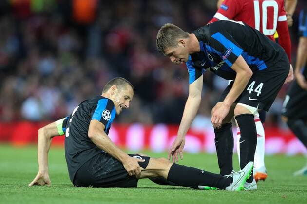 - MANCHESTER, UNITED KINGDOM: Club s Timmy Simons lies injured on the ground during a soccer game between British club Manchester United ManU FC and Belgian team Club Brugge KV in Manchester, United Kingdom, Tuesday 18 August 2015, the first leg of the play-offs for the UEFA Champions League competition. BRUNOxFAHY x84379391x