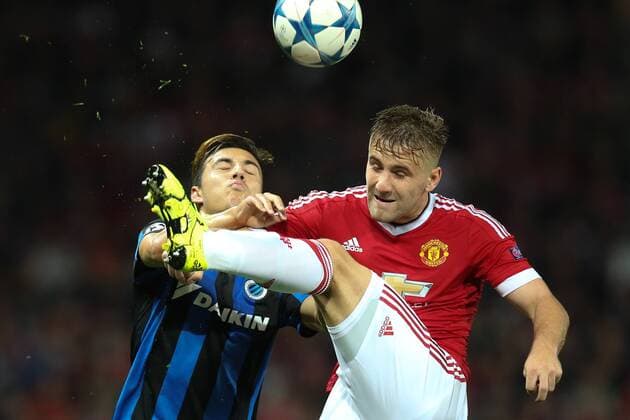 - MANCHESTER, UNITED KINGDOM: Club s Dion Cools and Manchester s Luke Shaw fight for the ball during a soccer game between British club Manchester United ManU FC and Belgian team Club Brugge KV in Manchester, United Kingdom, Tuesday 18 August 2015, the first leg of the play-offs for the UEFA Champions League competition. BRUNOxFAHY x84382391x