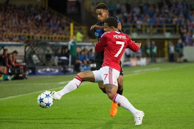 - BRUGGE, BELGIUM: Club s Jean-Charles Castelletto and Manchester s Memphis Depay fight for the ball during a soccer game between Belgian first league team Club Brugge KV and British club Manchester United ManU FC in Brugge, Wednesday 26 August 2015, the return game of the play-offs of the UEFA Champions League competition. Manchester United won the first leg 3-1. KURTxDESPLENTER x84637873x