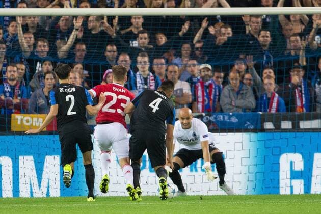 - BRUGGE, BELGIUM: Manchester s Luke Shaw and Club s goalkeeper Sinan Bolat fight for the ball during a soccer game between Belgian first league team Club Brugge KV and British club Manchester United ManU FC in Brugge, Wednesday 26 August 2015, the return game of the play-offs of the UEFA Champions League competition. Manchester United won the first leg 3-1. KURTxDESPLENTER x84637881x