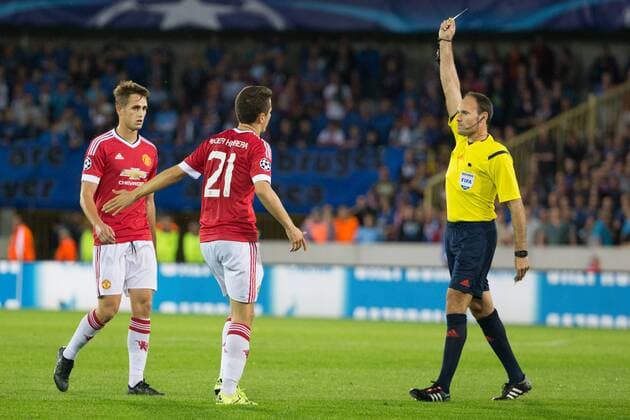 - BRUGGE, BELGIUM: Manchester s Ander Herrera receives a yellow card from referee Antonio Mateu Lahoz during a soccer game between Belgian first league team Club Brugge KV and British club Manchester United ManU FC in Brugge, Wednesday 26 August 2015, the return game of the play-offs of the UEFA Champions League competition. Manchester United won the first leg 3-1. KURTxDESPLENTER x84638052x