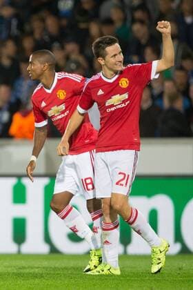 - BRUGGE, BELGIUM: Manchester s Ander Herrera (R) celebrates with his teammate Ashley Young after scoring during a soccer game between Belgian first league team Club Brugge KV and British club Manchester United ManU FC in Brugge, Wednesday 26 August 2015, the return game of the play-offs of the UEFA Champions League competition. Manchester United won the first leg 3-1. KURTxDESPLENTER x84639070x