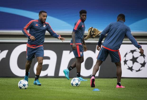 - GENT, BELGIUM: Lyon s Alexandre Lacazette and Lyon s Samuel Umtiti pictured in action during a training of Olympique Lyon, in Ghelamco Arena stadium in Gent, Tuesday 15 September 2015. Tomorrow French Olympique Lyon will play the first game in the group stage of the Uefa Champions League competition against Belgian first league soccer team KAA Gent. JASPERxJACOBS x85239403x