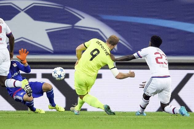 - GENT, BELGIUM: Lyon s goalkeeper Anthony Lopes, Gent s Laurent Depoitre and Lyon s Samuel Umtiti fight for the ball during the first game in the group stage of the Uefa Champions League competition, in group H, between Belgian first league soccer team KAA Gent and Olympique Lyon, in Gent, Wednesday 16 September 2015. YORICKxJANSENS x85279430x