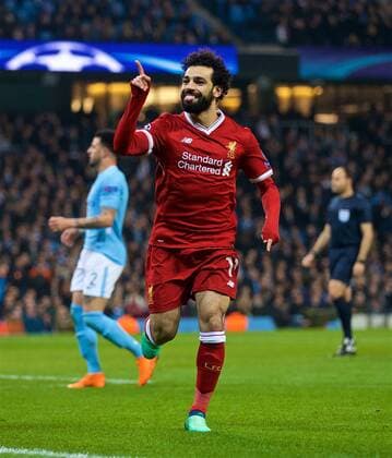 (180411) -- MANCHESTER, April 11, 2018 () -- Liverpool s Mohamed Salah celebrates after scoring during the UEFA Champions League quarterfinal second leg soccer match between Manchester City and Liverpool in Manchester, Britain, on April 10, 2018. Liverpool won 5-1 on aggregate and advanced to the semifinal. () FOR EDITORIAL USE ONLY. NOT FOR SALE FOR MARKETING OR ADVERTISING CAMPAIGNS. NO USE WITH UNAUTHORIZED AUDIO, VIDEO, DATA, FIXTURE LISTS, CLUB LEAGUE LOGOS OR LIVE SERVICES. ONLINE IN-MATCH USE LIMITED TO 45 IMAGES, NO VIDEO EMULATION. NO USE IN BETTING, GAMES OR SINGLE CLUB LEAGUE PLAYER PUBLICATIONS.) (SP)BRITAIN-MANCHESTER-SOCCER-UEFA CHAMPIONS LEAGUE-MANCHESTER CITY VS LIVERPOOL Xinhua