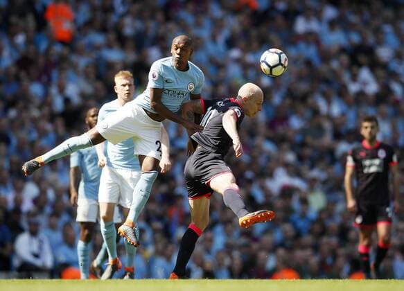 Manchester City s Fernandinho tussles with Huddersfield s Aaron Mooy during the premier league match at Etihad Stadium, Manchester. Picture date 5th May 2018. Picture credit should read: David Klein Sportimage EDITORIAL USE ONLY. No use with unauthorised audio, video, data, fixture lists, club league logos or live services. Online in-match use limited to 120 images, no video emulation. No use in betting, games or single club league player publications.