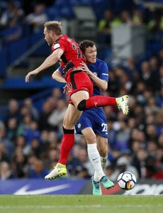 Chelsea s Andreas Christensen tussles with Huddersfield s Laurent Depoitre during the premier league match at the Stamford Bridge Stadium, London. Picture date 9th May 2018. Picture credit should read: David Klein Sportimage EDITORIAL USE ONLY. No use with unauthorised audio, video, data, fixture lists, club league logos or live services. Online in-match use limited to 120 images, no video emulation. No use in betting, games or single club league player publications.