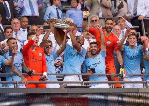 Vincent Kompany of Manchester City and Fernandinho of Manchester City lift the FA Community Shield during the The FA Community Shield Final match between Chelsea and Manchester City at Stamford Bridge, London, England on 5 August 2018. Copyright: xVincexxMignottx PMI-2135-0036