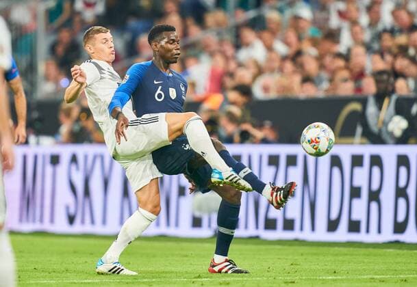 Germany - France, Soccer, Munich, September 06, 2018 Toni KROOS, DFB 8 compete for the ball, tackling, duel, header against Benjamin PAVARD, FRA 2 GERMANY - FRANCE Important: DFB regulations prohibit any use of photographs as image sequences and or quasi-video. Football Nations League, Season 2018 2019, September 06, 2018 Munich, Germany. Photographer: Peter Schatz MAGICS