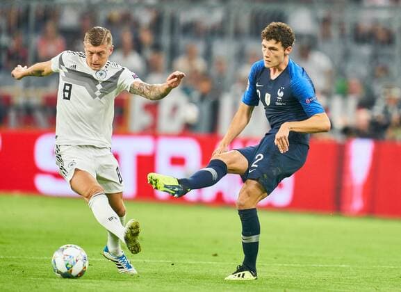 Germany - France, Soccer, Munich, September 06, 2018 Toni KROOS, DFB 8 compete for the ball, tackling, duel, header against Benjamin PAVARD, FRA 2 GERMANY - FRANCE Important: DFB regulations prohibit any use of photographs as image sequences and or quasi-video. Football Nations League, Season 2018 2019, September 06, 2018 Munich, Germany. Photographer: Peter Schatz MAGICS