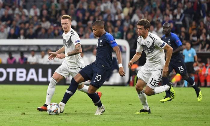 Fussball, Herren, Saison 2018 19, Nations League, Länderspiel in München, Deutschland - Frankreich, v. l. Marco Reus (Deutschland), Kylian Mbappe (Frankreich), Thomas Müller (Deutschland), 06.09.2018, Copyright: xMatthiasxKochx