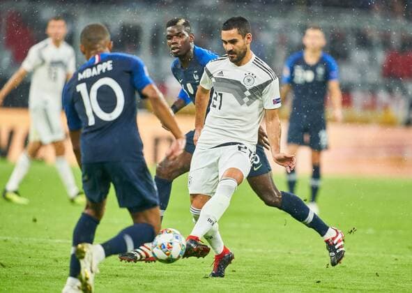 Germany - France, Soccer, Munich, September 06, 2018 Ilkay GUENDOGAN, DFB 21, compete for the ball, tackling, duel, header against Paul POGBA, FRA 6 Kylian MBAPPE, FRA 10 GERMANY - FRANCE Important: DFB regulations prohibit any use of photographs as image sequences and or quasi-video. Football Nations League, Season 2018 2019, September 06, 2018 Munich, Germany. Photographer: Peter Schatz MAGICS