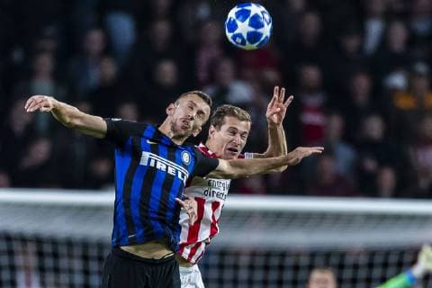 EINDHOVEN, Netherlands, 03-10-2018, football, Philips stadium, Champions league, season 2018 2019, Inter Milan player Ivan Perisic (L, PSV player Daniel Schwaab (R), during the match PSV - Inter Milan, PSV - Inter Milan x2517847x