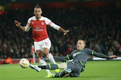 (181109) -- LONDON, Nov. 9, 2018 (Xinhua) -- Arsenal s Pierre-Emerick Aubameyang (L) is tackled by Sporting Lisbon s Jeremy Mathieu during the UEFA Europa League group E match between Arsenal and Sporting Lisbon at the Emirates Stadium in London, Britain on Nov. 8, 2018. The final score was 0-0. (Xinhua Tim Ireland) FOR EDITORIAL USE ONLY. NOT FOR SALE FOR MARKETING OR ADVERTISING CAMPAIGNS. NO USE WITH UNAUTHORIZED AUDIO, VIDEO, DATA, FIXTURE LISTS, CLUB LEAGUE LOGOS OR LIVE SERVICES. ONLINE IN-MATCH USE LIMITED TO 45 IMAGES, NO VIDEO EMULATION. NO USE IN BETTING, GAMES OR SINGLE CLUB LEAGUE PLAYER PUBLICATIONS. (SP) BRITAIN-LONDON-FOOTBALL-EUROPA LEAGUE-ARSENAL VS SPORTING LISBON