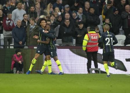 Raheem Sterling of Manchester City celebrates scoring with Leroy San? of Manchester City during the Premier League match between West Ham United and Manchester City at the Olympic Park, London, England on 24 November 2018. Copyright: xVincexxMignottx PMI-2420-0066