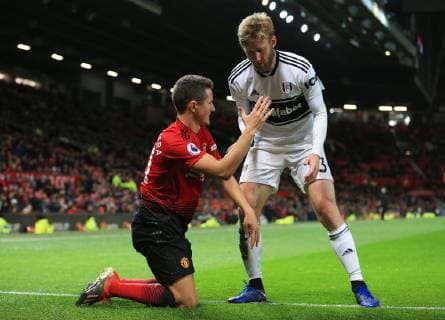 Manchester United ManU s Ander Herrera is helped up by Matt O Riley of Fulham during the Premier League match at Old Trafford, Manchester. Picture date: 8th December 2018. Picture credit should read: Matt McNulty Sportimage EDITORIAL USE ONLY. No use with unauthorised audio, video, data, fixture lists, club league logos or live services. Online in-match use limited to 120 images, no video emulation. No use in betting, games or single club league player publications. AD5T9123