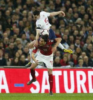 (190323) -- LONDON, March 23, 2019 -- England s Michael Keane (top) vies with the Czech Republic s Patrik Schick during the Euro 2020 qualifying Group A match between England and Czech Republic at Wembley Stadium in London, Britain on March 22, 2019. England won 5-0. FOR EDITORIAL USE ONLY. NOT FOR SALE FOR MARKETING OR ADVERTISING CAMPAIGNS. NO USE WITH UNAUTHORIZED AUDIO, VIDEO, DATA, FIXTURE LISTS, CLUB LEAGUE LOGOS OR LIVE SERVICES. ONLINE IN-MATCH USE LIMITED TO 45 IMAGES, NO VIDEO EMULATION. NO USE IN BETTING, GAMES OR SINGLE CLUB LEAGUE PLAYER PUBLICATIONS. ) (SP)BRITAIN-LONDON-FOOTBALL-EURO 2020 QUALIFYING-ENGLAND VS CZECH REPUBLIC MatthewxImpey