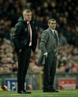(190411) -- MANCHESTER, April 11, 2019 (Xinhua) -- Manchester United ManU s manager Ole Gunnar Solskjaer (L) and Barcelona s head coach Ernesto Valverde observe during the UEFA Champions League Quarter-Final first leg match between Manchester United and FC Barcelona Barca at Old Trafford in Manchester, Britain on April 10, 2019. Barcelona won 1-0. (Xinhua) FOR EDITORIAL USE ONLY. NOT FOR SALE FOR MARKETING OR ADVERTISING CAMPAIGNS. NO USE WITH UNAUTHORIZED AUDIO, VIDEO, DATA, FIXTURE LISTS, CLUB LEAGUE LOGOS OR LIVE SERVICES. ONLINE IN-MATCH USE LIMITED TO 45 IMAGES, NO VIDEO EMULATION. NO USE IN BETTING, GAMES OR SINGLE CLUB LEAGUE PLAYER PUBLICATIONS. (SP)BRITAIN-MANCHESTER-FOOTBALL-CHAMPIONS LEAGUE-QUARTERFINAL-MAN UNITED VS BARCELONA