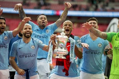 Vincent Kompany of Manchester City and his team mates lift the FA Trophy during The FA Cup Final match between Manchester City and Watford at Wembley Stadium, London, England on 18 May 2019. Copyright: xSalvioxCalabresex 24040055