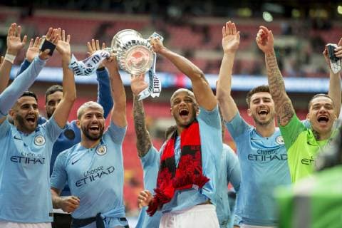 Vincent Kompany of Manchester City and his team mates lift the FA Trophy during The FA Cup Final match between Manchester City and Watford at Wembley Stadium, London, England on 18 May 2019. Copyright: xSalvioxCalabresex 24040057