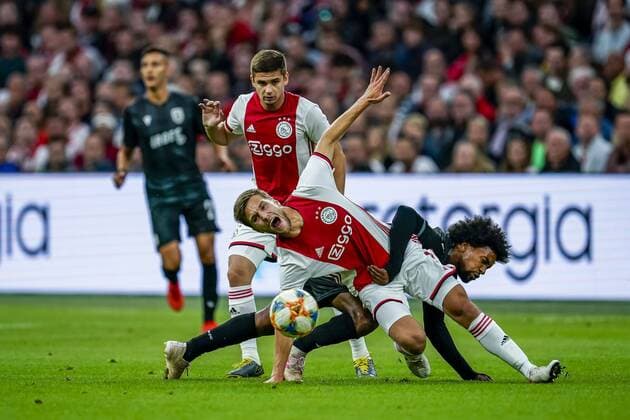 AMSTERDAM, Netherlands, 13-08-2019, football, Johan Cruijff ArenA, Champions League third qualifying round, season 2019-2020, Ajax player Joel Veltman (L), PAOK Saloniki player Diego Biseswar (R), during the match Ajax - PAOK, Ajax - PAOK x4105319x Copyright: