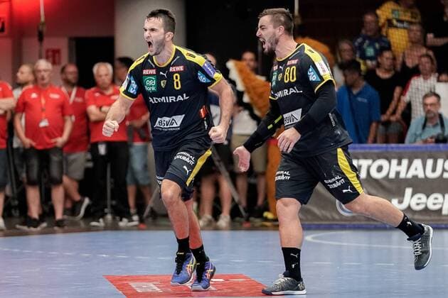 v.li.: Romain Lagarde (RNL, 8) und Jannik Kohlbacher (RNL, 80) jubeln über ein Tor, Jubel, Torjubel, Torerfolg, celebrate the goal, goal, celebration, Jubel ueber das Tor, optimistisch, Spielszene, Highlight, Action, Aktion, 25.08.2019, Ludwigshafen am Rhein (Deutschland), Handball, Bundesliga, TSG Ludwigshafen-Friesenheim (Die Eulen) - Rhein-Neckar Löwen