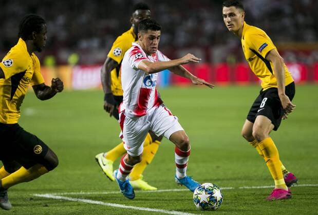 27th August 2019, Rajko Mitic Stadium, Belrgrade, Serbia; UEFA Champions league football, qualifying, Red Star Belgrade versus Young Boys; Mateo Garcia of Red Star Belgrade passes between three players of Younger Boys - Strictly Editorial Use Only. No use with unauthorized audio, video, data, fixture lists, club league logos or live services. Online in-match use limited to 120 images, no video emulation. No use in betting, games or single club league player publications ActionPlus12163642 NikolaxKristic