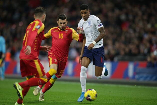 Vladimir Jovovic of Montenegro tackles Marcus Rashford of England during the UEFA EURO, EM, Europameisterschaft,Fussball 2020 Qualifying match at Wembley Stadium, London. Picture date: 14th November 2019. Picture credit should read: Paul Terry Sportimage EDITORIAL USE ONLY. No use with unauthorised audio, video, data, fixture lists, club league logos or live services. Online in-match use limited to 120 images, no video emulation. No use in betting, games or single club league player publications. SPI-0315-0004