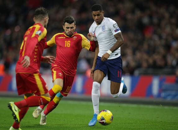 Vladimir Jovovic of Montenegro tackles Marcus Rashford of England during the UEFA EURO, EM, Europameisterschaft,Fussball 2020 Qualifying match at Wembley Stadium, London. Picture date: 14th November 2019. Picture credit should read: Paul Terry Sportimage EDITORIAL USE ONLY. No use with unauthorised audio, video, data, fixture lists, club league logos or live services. Online in-match use limited to 120 images, no video emulation. No use in betting, games or single club league player publications. SPI-0315-0011