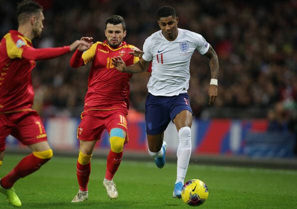 Vladimir Jovovic of Montenegro tackles Marcus Rashford of England during the UEFA EURO, EM, Europameisterschaft,Fussball 2020 Qualifying match at Wembley Stadium, London. Picture date: 14th November 2019. Picture credit should read: Paul Terry Sportimage EDITORIAL USE ONLY. No use with unauthorised audio, video, data, fixture lists, club league logos or live services. Online in-match use limited to 120 images, no video emulation. No use in betting, games or single club league player publications. SPI-0315-0020