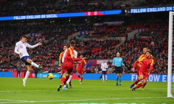Mason Mount of England misss hits a shot which is put onto his own net by Aleksandar Sofranac of Montenegro (20) during the UEFA EURO, EM, Europameisterschaft,Fussball 2020 Qualifying match at Wembley Stadium, London. Picture date: 14th November 2019. Picture credit should read: Paul Terry Sportimage EDITORIAL USE ONLY. No use with unauthorised audio, video, data, fixture lists, club league logos or live services. Online in-match use limited to 120 images, no video emulation. No use in betting, games or single club league player publications. SPI-0315-0050