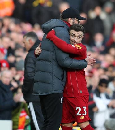14th December 2019; Anfield, Liverpool, Merseyside, England; English Premier League Football, Liverpool versus Watford; Liverpool manager Jurgen Klopp hugs Xherdan Shaqiri as he is substituted off - Strictly Editorial Use Only. No use with unauthorized audio, video, data, fixture lists, club league logos or live services. Online in-match use limited to 120 images, no video emulation. No use in betting, games or single club league player publications ActionPlus12196473 DavidxBlunsden