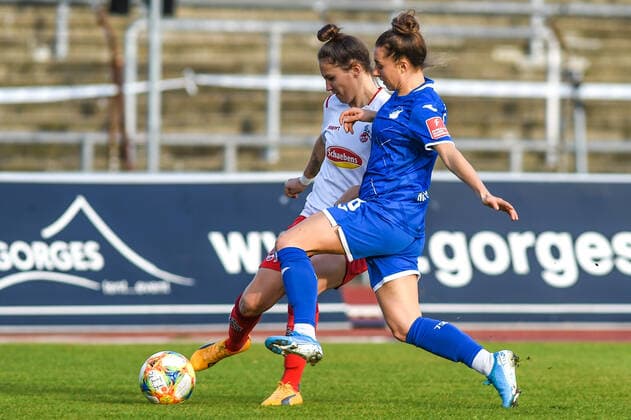 v.li.: Sabrina Horvat (Köln, 3), Anne Fühner (TSG, 18), Zweikampf, Duell, duel, tackle, tackling, Dynamik, Action, Aktion, 15.12.2019, Köln (Deutschland), Fussball, Flyeralarm Frauen-Bundesliga, 1. FC Köln - TSG Hoffenheim, DFB DFL REGULATIONS PROHIBIT ANY USE OF PHOTOGRAPHS AS IMAGE SEQUENCES AND OR QUASI-VIDEO.