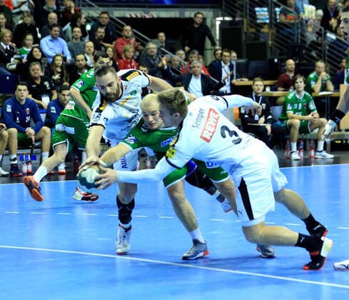 GER, DHB, 1.HBL, FUECHSE BERLIN VS. SC DHfK LEIPZIG 26.12.2019, Max Schmeling Halle, Berlin, GER, DHB, 1.HBL, FUECHSE BERLIN VS. SC DHfK LEIPZIG, DHB regulations prohibit any use of photographs as image sequences and or quasi-videoPaul Drux (Fuechse Berlin 95), , Alen Milosevic (SC DHfK Leipzig 34), Franz Semper (SC DHfK Leipzig 3)