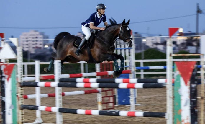 February 27, 2020, Gaza City, Gaza Strip, Palestinian Territory: A Palestinian horse rider on his horse jumps over a barrier during the first championship in jump barriers for the year 2020, on February 27, 2020 Middle East News - February 27, 2020 - ZUMAap3_ 97337261st Copyright: xMahmoudxAjjourx