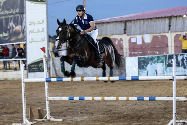 February 27, 2020, Gaza City, Gaza Strip, Palestinian Territory: A Palestinian horse rider on his horse jumps over a barrier during the first championship in jump barriers for the year 2020, on February 27, 2020 Middle East News - February 27, 2020 - ZUMAap3_ 97337371st Copyright: xMahmoudxAjjourx