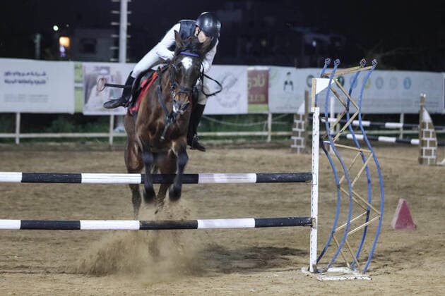 February 27, 2020, Gaza City, Gaza Strip, Palestinian Territory: A Palestinian horse rider on his horse jumps over a barrier during the first championship in jump barriers for the year 2020, on February 27, 2020 Middle East News - February 27, 2020 - ZUMAap3_ 97337373st Copyright: xMahmoudxAjjourx