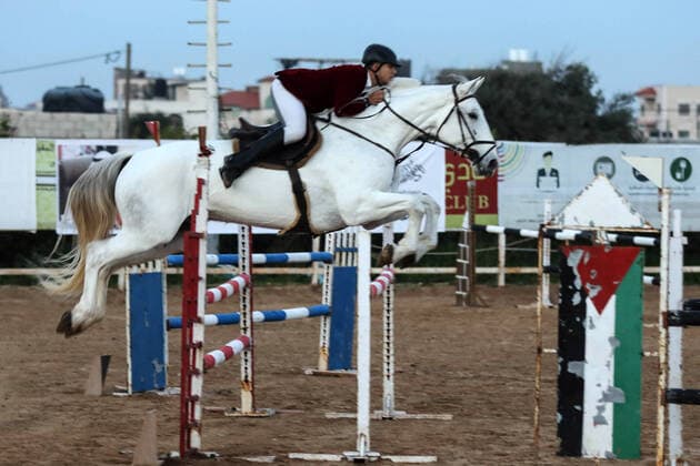 February 27, 2020, Gaza City, Gaza Strip, Palestinian Territory: A Palestinian horse rider on his horse jumps over a barrier during the first championship in jump barriers for the year 2020, on February 27, 2020 Middle East News - February 27, 2020 - ZUMAap3_ 97337385st Copyright: xMahmoudxAjjourx
