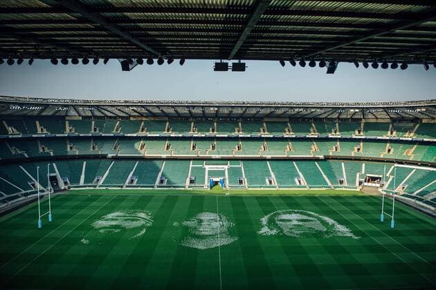 The pitch at Twickenham Stadium has been transformed into a stunning portrait featuring three of Premiership Rugby?s star players today (12th August 2020). The giant rugby art, the largest outdoor painting ever created in the UK, was unveiled to celebrate the restart of Gallagher Premiership Rugby on Friday 14 th August when Harlequins take on Sale Sharks at 7:45pm, just 200 metres away. The artwork features Harlequins player, Joe Marler; Saracens? Maro Itoje, as well as Sale Sharks? Rugby World Cup winner Faf de Klerk. It took team of eight artists more than 24 hours to complete the pitch portrait and more than 100 hours of planning before any paint touched the grass. A bespoke computer program was written to generate the precise measurements that were needed to create the artwork to the exact scale of the stadium. The image, which occupies most of the 7,000 square metre pitch, was created using a grid comprised of 13,420 elements. Each painted line in the portrait is just 6 inches wide. Nearly 1280 litres of biodegradable pitch marker paint were used for the elaborate creation. An estimated 150,000 passengers will enjoy the spectacle from the sky this week on flights in and out of London?s Heathrow airport. Faf de Klerk was one of the featured Premiership Rugby stars in the portrait. The Sale Sharks star said, I didn t realise it was going to be on the field, I thought it was going to be a photo up somewhere or on the big screen. It s looking really cool. There are a lot of great players in the Premiership, and it is amazing. I feel really privileged and quite humble . Speaking about the impact of lockdown on the Saracens star Maro Itoje said The last few months have been really tough on fans and players but we?re back and we?re ready for the start of the season on Friday 14th August. The past five months has shown us how important the sport is and what it brings to people lives. British artist John Lundberg, who oversaw the po Copyright: xScottxGarfitt PinPep CoverxImagesx 0103040087st EDITORIAL USE ONLY. RESTRICTED TO NEWSPAPERS BASED IN THE UK