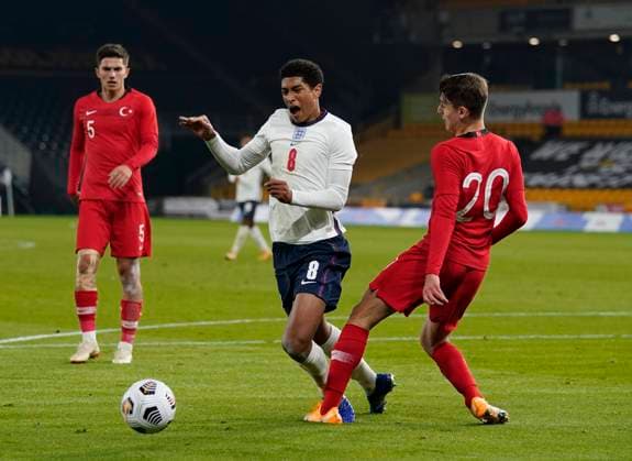 Jude Bellingham of England is fouled by Ravil Tagir of Turkey in the area although a penalty is not given during the UEFA EURO, EM, Europameisterschaft,Fussball U21, U 21 Qualifying match at Molineux, Wolverhampton. Picture date: 13th October 2020. Picture credit should read: Andrew Yates Sportimage EDITORIAL USE ONLY. No use with unauthorised audio, video, data, fixture lists, club league logos or live services. Online in-match use limited to 120 images, no video emulation. No use in betting, games or single club league player publications. SPI-0696-0006