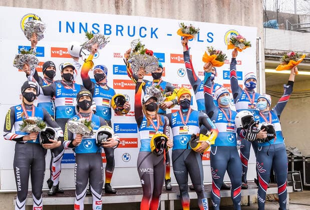 29.11.2020, Olympia Eiskanal, Innsbruck, AUT, Viessmann Rennrodel Weltcup, Igls, Team-Staffel Bewerb, Siegerehrung, im Bild Podium mit v.l. Team Österreich (2. Platz), Team Deutschland (1. Platz) und Team Russland (3. Platz) Podium with (left to right: ) second Placed Team of Austria Winning Team of Germany and third placed Team of Russia during the winner ceremony for the Team Relay Competition of Viessmann World Cup at the Olympia Eiskanal in Innsbruck, Austria on 2020 11 29.