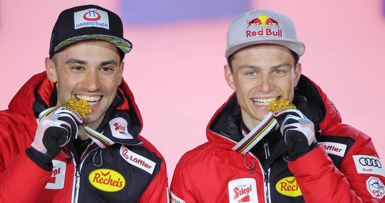 NORDIC SKIING - FIS Nordic World Ski Championships Oberstdorf 2021 OBERSTDORF,GERMANY,06.MAR.21 - NORDIC SKIING, NORDIC COMBINED, Ski jumping, Skispringen, Ski, nordisch - FIS Nordic World Ski Championships, team sprint, large hill, men, award ceremony. Image shows the rejoicing of Lukas Greiderer and Johannes Lamparter (AUT). GEPAxpictures xThomasxBachun