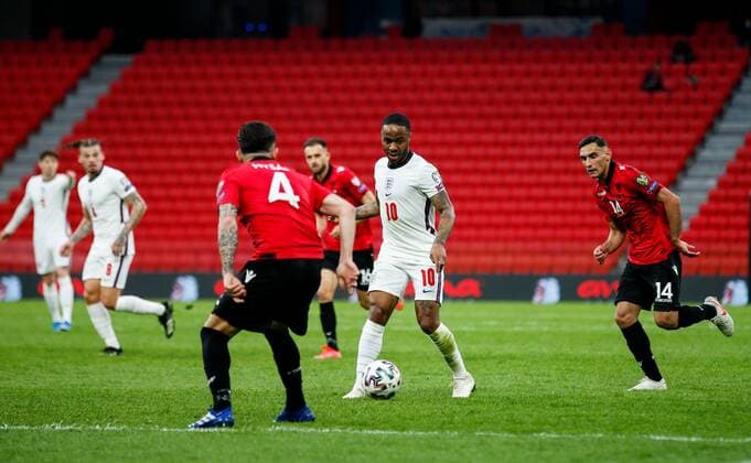 Mandatory Credit: Photo by Nikola Krstic BPI Shutterstock (11832717cq) Raheem Sterling of England with Elseid Hysaj of Albania and Qazim Laci of Albania (right) Albania v England, FIFA World Cup, WM, Weltmeisterschaft, Fussball Qualifying Group I, Football, Arena Kombetare, Tirana, Albania - 28 Mar 2021 Albania v England, FIFA World Cup Qualifying Group I, Football, Arena Kombetare, Tirana, Albania - 28 Mar 2021 Copyright: xNikolaxKrstic BPI Shutterstockx 11832717cq