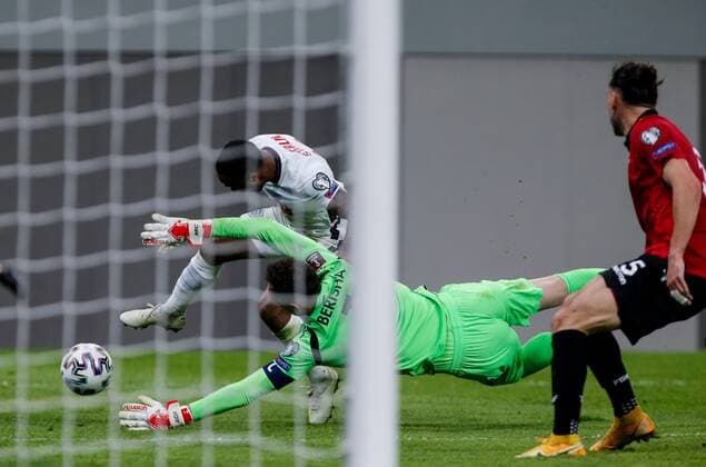 Mandatory Credit: Photo by Nikola Krstic BPI Shutterstock (11832717em) Raheem Sterling of England and Etrit Berisha goalkeeper of Albania Albania v England, FIFA World Cup, WM, Weltmeisterschaft, Fussball Qualifying Group I, Football, Arena Kombetare, Tirana, Albania - 28 Mar 2021 Albania v England, FIFA World Cup Qualifying Group I, Football, Arena Kombetare, Tirana, Albania - 28 Mar 2021 Copyright: xNikolaxKrstic BPI Shutterstockx 11832717em